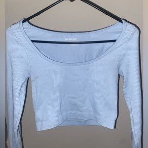 Size XS. Blue low top long sleeve from Garage
